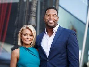 Television host Kelly Ripa (L) and Michael Strahan attend the Hollywood Walk of Fame on October 12, 2015 in Hollywood, California.   Mark Davis/Getty Images/AFP