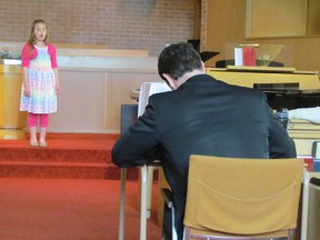 Ava Laporte, 9, of Brigden, is shown in this April 2015 file photo performing for adjudicator Todd Wieczorek of London during the Lambton County Music Festival. This year's festival runs April 25 to May 6.
File photo/Sarnia Observer/Postmedia Network