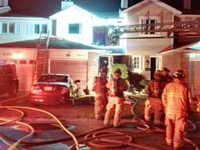 Ottawa firefighters operating at a Working Fire in a row home on Colony Private in Orléans on April 20, 2016. (Ottawa Fire photo)