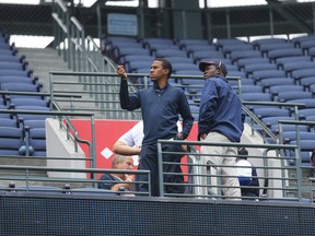 Atlanta Braves employees stand at the portal of section 401 near where fan Gregory Murrey fell from the top deck to his death during Saturday’s game between the Braves and the New York Yankees, Sunday, Aug. 30, 2015, in Atlanta. (Curtis Compton/Atlanta Journal-Constitution via AP)