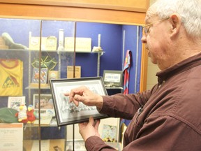 Ken Dunsmore, group commissioner of the 1st Strathroy Scouting Group, showing a picture of a 1964 group, which included Bill Gibson, former Strathroy-Caradoc Fire Chief.JONATHAN JUHA/STRATHROY AGE DISPATCH/POSTMEDIA NETWORK