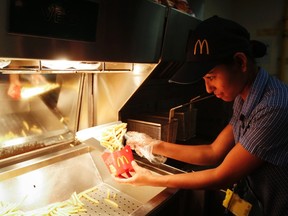 A staff member prepares French fries at a McDonald's restaurant in Mumbai February 10, 2015. (REUTERS/Shailesh Andrade)