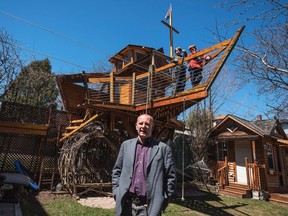 John Alpeza stands in front of the treehouse he built for his two sons Kristian, 10, top left, and Matheas, 8, in Toronto on Wednesday, April 20, 2016. City officials want it torn down. (THE CANADIAN PRESS/Aaron Vincent Elkaim)
