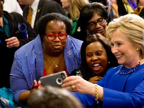 Democratic presidential candidate Hillary Clinton takes pictures with supporters after a campaign event at the Central Baptist Church in Columbia, S.C. Feb. 23, 2016. (AP Photo/Jacquelyn Martin)