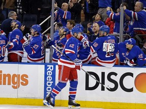 Rangers centre Eric Staal (12) celebrates scoring a goal with teammate and brother Marc Staal (18) against the Penguins during NHL action at Madison Square Garden in New York City on March 27, 2016. (Adam Hunger/USA TODAY Sports)