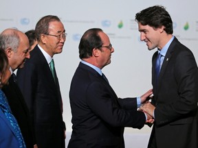 French President Francois Hollande (2nd R), French Foreign Affairs Minister Laurent Fabius (L) and United Nations Secretary General Ban Ki-moon (2nd L) welcome Canada's Prime Minister Justin Trudeau (R) as he arrives for the opening day of the World Climate Change Conference 2015 (COP21) at Le Bourget, near Paris, France, on November 30, 2015. REUTERS/Christian Hartmann