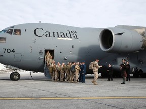 Canadian soldiers returning from Afghanistan are greeted by dignitaries in Ottawa in this March 18, 2014 file photo. REUTERS/Blair Gable