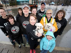 Members of Winnipeg Lost Dog Alert pose for a photo in Winnipeg.