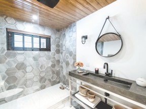 A long transom was decided upon and positioned in the shower stall, allowing natural light to flood in without compromising modesty.