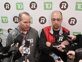 Ottawa Redblacks coach Rick Campbell and GM Marcel Desjardins talk to the media as the players clear out their lockers at TD Place in Ottawa on Dec. 1, 2015. (THE CANADIAN PRESS/ Patrick Doyle)