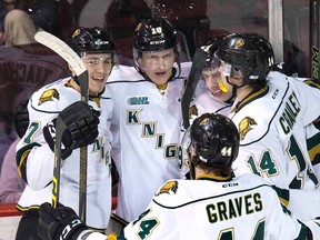 London Knights celebrate the team?s fifth goal in a 7-4 win in Game 1 of their OHL Western Conference championship series against the Erie Otters Wednesday night in Erie, Pa. (DEREK RUTTAN, The London Free Press)