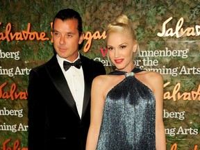 In this Oct. 17, 2013 file photo, musicians Gavin Rossdale, left, and Gwen Stefani arrive at the Wallis Annenberg Center for the Performing Arts Inaugural Gala in Beverly Hills, Calif. Records show a Los Angeles judge finalized the pair's divorce on Friday, April 8, 2016, after the musicians reached an agreement to divide their property and assets, and share joint custody of their three children. Stefani filed for divorce in August 2015 after nearly 13 years of marriage. (Photo by Chris Pizzello/Invision/AP, File)