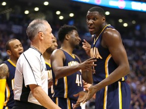 Pacers' Ian Mahinmi (right) looks for the foul call against Toronto Raptors Jonas Valiciunas during the second quarter in Toronto, Ont. on Tuesday April 19, 2016. (Jack Boland/Toronto Sun)