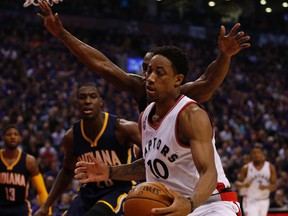 Raptors' DeMar DeRozan (10) is marked by Pacers' Ian Mahinmi (28) during second quarter NBA playoff action in Toronto on Tuesday, April 19, 2016. (Jack Boland/Toronto Sun)