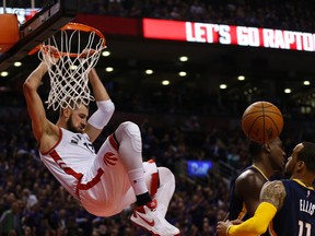 Raptors' Jonas Valanciunas completes a slam dunk against the Pacers during second quarter NBA playoff action in Toronto on Tuesday, April 19, 2016. (Jack Boland/Toronto Sun)