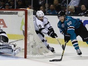 San Jose Sharks forward Chris Tierney, right, drives around Los Angeles Kings defenceman Drew Doughty Wednesday, April 20, 2016, in San Jose, Calif. (AP Photo/Ben Margot)