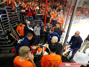 Philadelphia Flyers forward Scott Laughton is transported off the ice after an injury during Game 4 of their first-round playoff series against the Washington Capitals Wednesday, April 20, 2016, in Philadelphia. (AP Photo/Matt Slocum)
