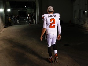 In this Nov. 5, 2015, file photo, Cleveland Browns quarterback Johnny Manziel walks off the field after an 31-10 loss to the Cincinnati Bengals, in Cincinnati. (AP Photo/Frank Victores, File)