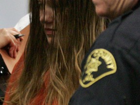 This Jan. 8. 2008, file photo shows Michele Anderson, left, who is accused of killing six members of her family on Dec. 24, 2007,  in Carnation, Wash.  A Seattle jury Friday, March 4, 2016, convicted the 37-year-old woman of killing six members of her family on Christmas Eve 2007 during a holiday gathering. Anderson was found guilty of six counts of first-degree aggravated murder following a five-week trial in King County Superior Court.  (Ken Lambert/The Seattle Times via AP)