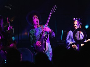 Prince performs onstage with 3RDEYEGIRL during their "HITnRUN" tour at Sony Centre For The Performing Arts on May 19, 2015 in Toronto. (Cindy Ord/Getty Images for NPG Records 2015/AFP)