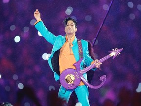 In this Feb. 4, 2007 file photo, Prince performs during the halftime show at the Super Bowl XLI football game at Dolphin Stadium in Miami.  (AP Photo/Chris O'Meara, File)