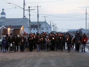 People take part in a march and candlelight vigil in the Attawapiskat First Nation in northern Ontario on April 15, 2016. REUTERS/Chris Wattie