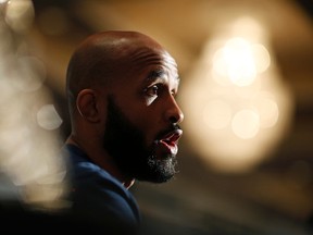 Demetrious Johnson speaks with the media during a UFC 197 news conference in Las Vegas on April 21, 2016. (AP Photo/John Locher)