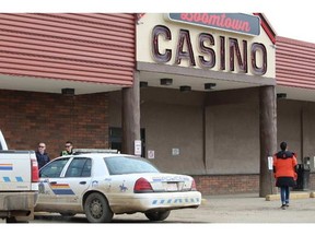 Officers secure the scene of a shooting outside the Boomtown Casino in downtown Fort McMurray. The victim died April 20, 2016, in an Edmonton hospital. Postmedia