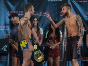 Andrew McInnes, right, gestures at Tom Gallicchio Thursday at West Edmonton Mall during the weigh-in for the Triumph Fighting Championship: Inception card. The fight is Friday at the Shaw Conference Centre. (Shaughn Buttts)