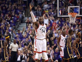Toronto Raptors forward Patrick Patterson celebrates after making a three-point shot against the Indiana Pacers in game two of the first round of the 2016 NBA Playoffs at Air Canada Centre. (Tom Szczerbowski-USA TODAY Sports)