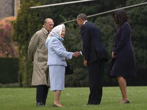 President Barack Obama and first lady Michelle Obama are greeted by Queen Elizabeth II and Prince Philip as they arrive on Marine One at Windsor Castle in Windsor, England, on April 22, 2016. (AP Photo/Carolyn Kaster)