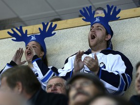 Manitoba Moose fans cheer on their team in its home opener against the Ontario Reign at MTS Centre in Winnipeg on Thu., Oct. 15, 2015.