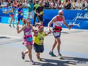 Sarnia's Wes Harding, right, is pictured near the finish of the Boston Marathon Monday with John Young and Shannon Porges. Though his result was poor this year, Harding said, the experience was memorable. (Supplied Photo)