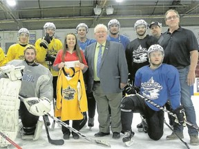 Trenton Golden Hawks players and team management presented Lily Messier, 16, of Foxboro with a $1,000 donation Thursday at the Community Gardens in Trenton. Messier is a goalie with the Canadian U19 women's floorball team. She said the money will help off-set expenses heading into the World Floorball Championships that begin May 4 in Belleville. Quinte West Mayor Jim Harrison also made a personal donation of $100.