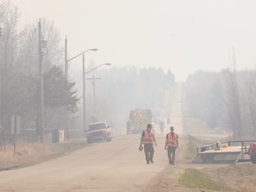 Thick smoke could be seen as the brush fire ) burns north of Duffield on April 17. Residents were allowed to return to their homes to pick up essentials on April 19 before being bused back to the evacuation centre. - photo by Marcia Love