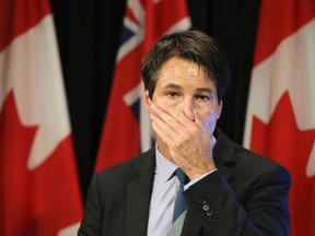 Minister of Health Dr. Eric Hoskins discusses doctor billings at a press conference on Friday. (Veronica Henri/Toronto Sun/Postmedia Network)