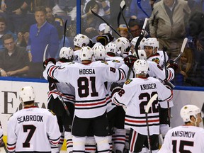 Members of the Blackhawks celebrate after defeating the Blues during the second overtime period in Game 5 of the first round NHL playoff series in St. Louis on Thursday, April 21, 2016. (Billy Hurst/USA TODAY Sports)