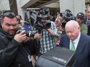 Senator Mike Duffy is mobbed by media outside the Elgin Street Courthouse following his acquittal of all 31 charges. (WAYNE CUDDINGTON/Postmedia Network)