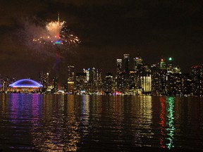 Toronto's skyline lights up in fireworks during the opening ceremonies of the 2015 Pan Am Games in Toronto on Friday July 10, 2015. (Dave Abel/Toronto Sun/Postmedia Network)