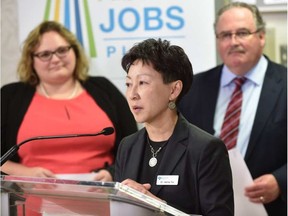 Alberta Health Services Dr. Verna Yu is flanked by Health Minister Sarah Hoffman and Infrastructure Minister Brian Mason to announce a $759.5-million maintenance and renewal of Alberta's health-care facilities at a University Hospital news conference in Edmonton, April 22, 2016. (Ed Kaiser photo)