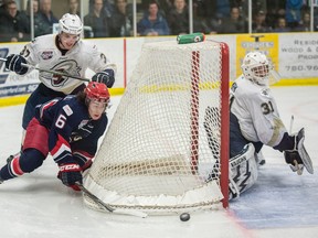 Matthew Murray of the Spruce Grove Saints, watches the wrap around attempt by Shane Bear of the Brooks Bandits Friday in Game 5 of their AJHL playoff series at Grant Fuhr Arena in Spruce Grove. (Shaughn Butts)