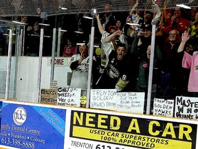 Belleville native Hunter Fargey puckers up while hoisting the Frank L. Buckland Cup in front of more than 1,200 screaming Trenton Golden Hawks fans, after the Hawks clipped the Georgetown Raiders 2-1 to clinch the city's first OJHL championship Friday at the Community Gardens. (TIM MEEKS/THE INTELLIGENCER)