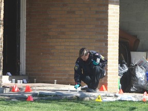 A man, 30, was killed and three others wounded by gunfire at a Mississauga townhouse complex early Saturday. Peel Regional Police forensics officers spent the morning at 7475 Goreway Dr. gathering evidence at a unit investigators suspect has been operating as an after-hours club. CHRIS DOUCETTE/TORONTO SUN