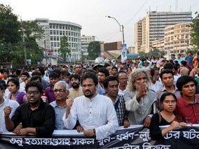 Bangladeshi activists and students shout slogans demanding arrest of three motorcycle-riding assailants who hacked and shot student activist Nazimuddin Samad to death as he walked with a friend, in Dhaka, Bangladesh, Friday, April 8, 2016. Police suspect 28-year-old Samad was targeted for his outspoken atheism in the Muslim majority country and for supporting a 2013 movement demanding capital punishment for war crimes involving the country's independence war against Pakistan in 1971. (AP Photo)