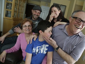 Franjo and Dobrila Grubesic came to Canada  20 years ago as refugees from the former Yugoslavia -  war-torn Sarajevo - and made  Canada their new home through hard work and raising a family. (Bottom L clockwise) Dobrila, her son Dragan, daughter Jelena, husband Franjo and grandson David aged 7 in their Etobicoke condo. on Wednesday April 20, 2016. Jack Boland/Toronto Sun/Postmedia Network