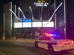 Peel police at the theatre at Square One Shopping Mall in Mississauga after it was evacuated Friday, April 22, 2016 after someone discharged a pepper spray-like substance. Theatres in Brampton and Scarborough had to be evacuated at the same time for similar incidents. (JOE WARMINGTON/TORONTO SUN)