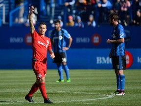 TFC's Sebastian Giovinco celebrates after scoring one of his two goals on Saturday against Montreal. (USA TODAY SPORTS)