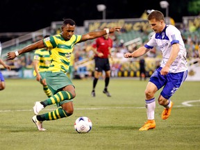 April 16, 2016, Tampa, Florida - FC Edmonton midfielder Jake Keegan, right, challenges Tampa Bay Rowdies defender Darnell King for the ball in an NASL contest. The Rowdies won 1-0.