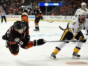 Ducks right wing Corey Perry (left) attempts a shot defended by Predators defenceman Ryan Ellis (right) during the second period in Game 5 of the first round NHL playoffs series in Anaheim on Saturday, April 23, 2016. (Kelvin Kuo/USA TODAY Sports)
