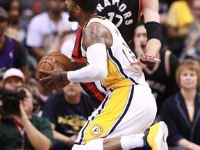 Pacers forward Paul George (13) drives to the basket against Raptors centre Jonas Valanciunas (17) during the second half of Game 4 of the first round NBA playoff series in Indianapolis on Saturday, April 23, 2016. (Brian Spurlock/USA TODAY Sports)